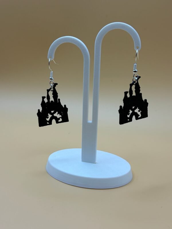 Pair of black magic castle silhouette dangle earrings on display stand - 3D printed EcoPlastic theme park jewellery by HulkyWears UK