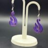Pair of purple-blue silk flame swirl dangle earrings on display stand - 3D printed EcoPlastic jewellery by HulkyWears UK