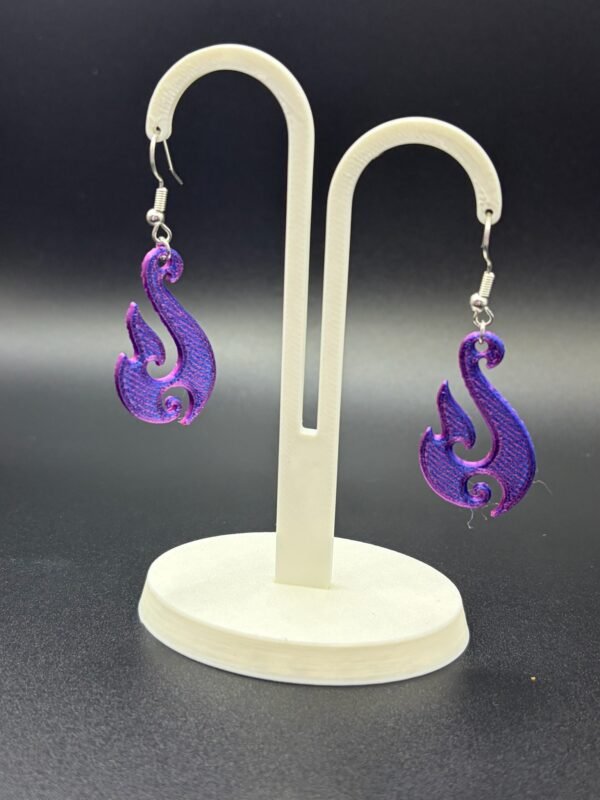 Pair of purple-blue silk flame swirl dangle earrings on display stand - 3D printed EcoPlastic jewellery by HulkyWears UK