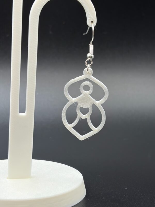 Close-up of white geometric goddess figure dangle earring with heart detail and silver hypoallergenic hook - HulkyWears 3D printed jewellery