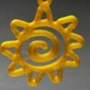 Pair of golden yellow spiral sun dangle earrings on display stand - 3D printed boho jewellery by HulkyWears UK