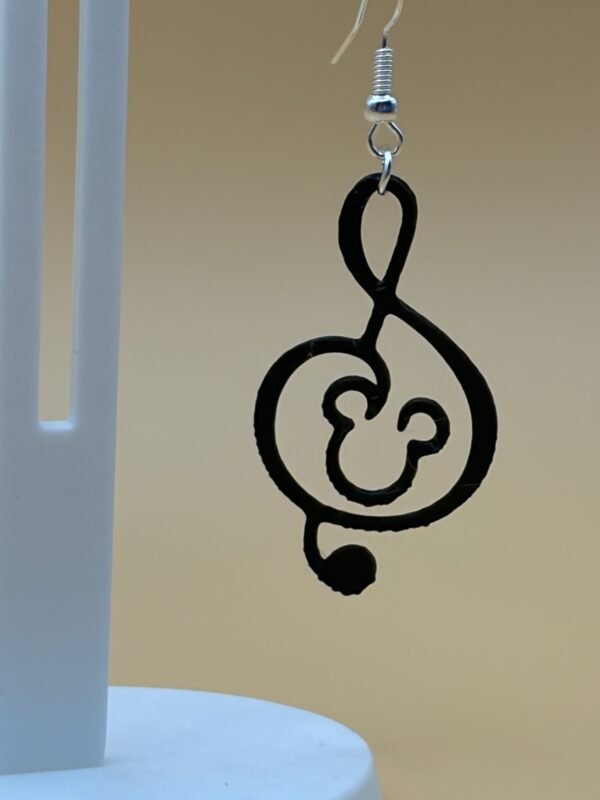 Close-up of black Mickey treble clef dangle earring with Mickey silhouette in clef body - HulkyWears 3D printed jewellery UK