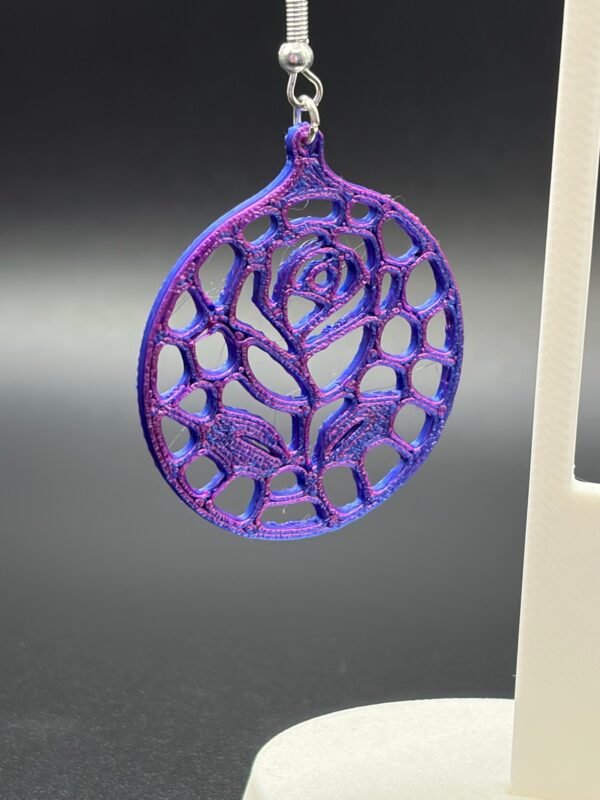 Close-up of purple-blue silk rose voronoi disc dangle earring showing organic lattice and rose detail - HulkyWears 3D printed jewellery UK
