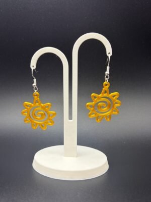Pair of golden yellow spiral sun dangle earrings on display stand - 3D printed boho jewellery by HulkyWears UK