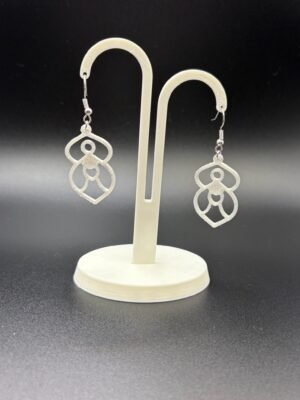 Pair of white goddess figure dangle earrings on display stand - 3D printed spiritual EcoPlastic jewellery by HulkyWears UK