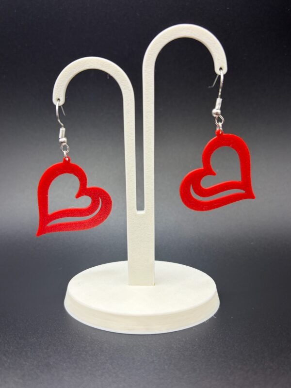 Pair of red open wave heart dangle earrings on display stand - 3D printed EcoPlastic jewellery by HulkyWears UK
