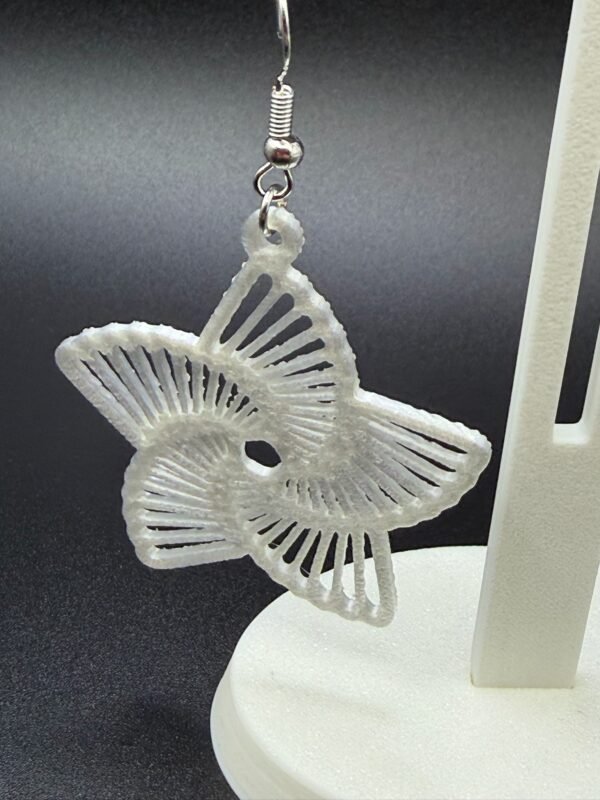 Close-up of white frosted star radial dangle earring showing open line cutout pattern - 3D printed EcoPlastic jewellery by HulkyWears
