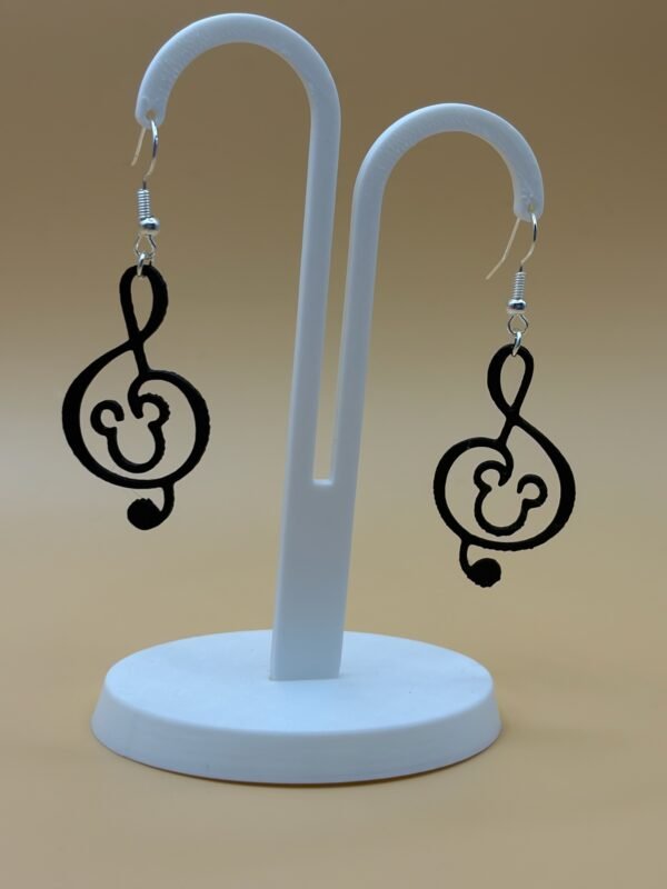 Pair of black Mickey treble clef dangle earrings on display stand - 3D printed music and magic fan jewellery by HulkyWears UK