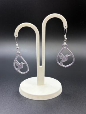 Pair of lilac hummingbird teardrop dangle earrings on display stand - 3D printed EcoPlastic nature jewellery by HulkyWears UK