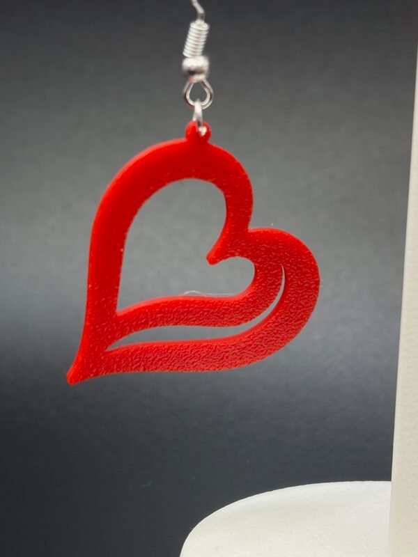 Pair of red open wave heart dangle earrings on display stand - 3D printed EcoPlastic jewellery by HulkyWears UK