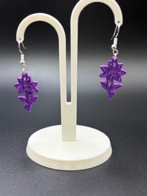 Pair of purple filigree flower dangle earrings on display stand - 3D printed boho jewellery by HulkyWears UK