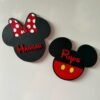 Personalised enchanted mouse head character magnet plaques — boy mouse with red costume and yellow buttons personalised with Rhys, and girl mouse with red sparkle polka dot bow personalised with Hannah, 3D printed UK