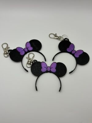 3D printed Minnie ear headband keyring with silk blue pink bow on silver lobster clasp hanging from a Disney Loungefly bag