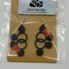 img 9181 HulkyWears 3D printed Minnie geometric bubble circle earrings on backing card in sealed packaging showing black cascading circles with red bow detail
