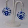 3D printed blue Stitch circle silhouette earrings matching pair on white display stand showing full open circle filigree design with Stitch and hibiscus detail
