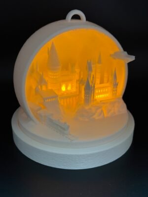 Hogwarts bauble full front view – white 3D printed Harry Potter castle diorama lit with warm LED light, with flying car and Hogwarts Express